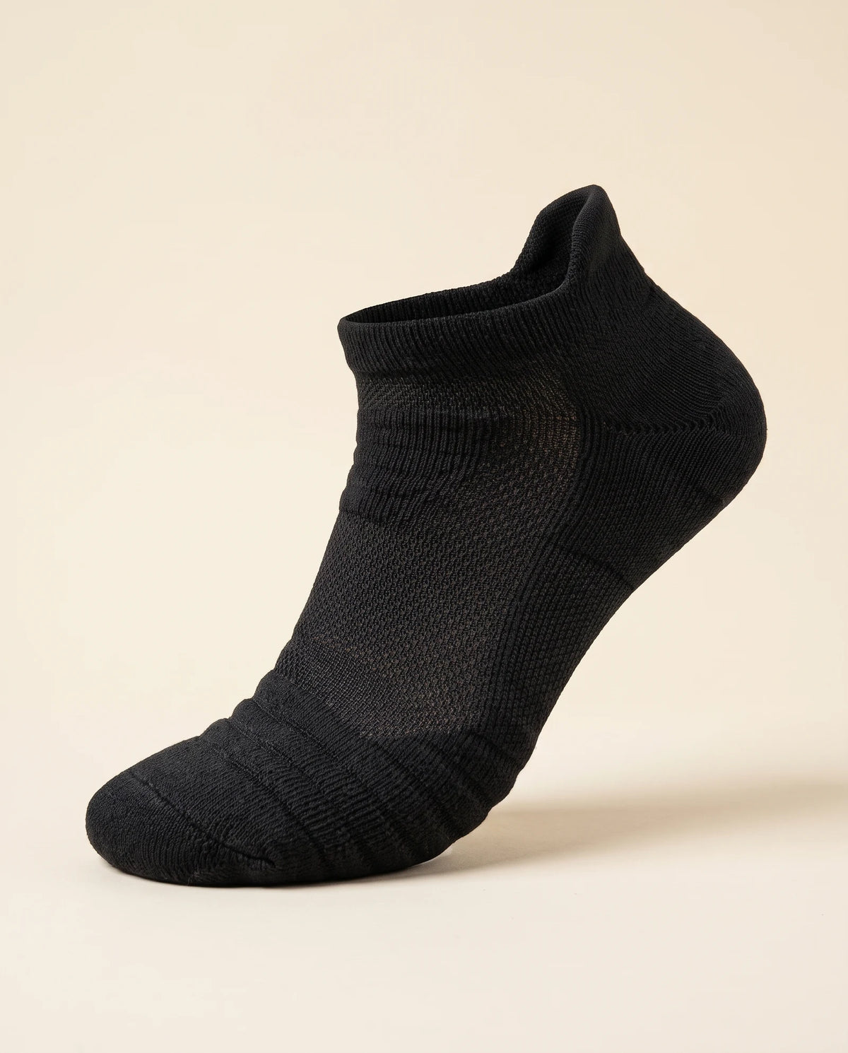 Black low-cut court sock, three-quarter view