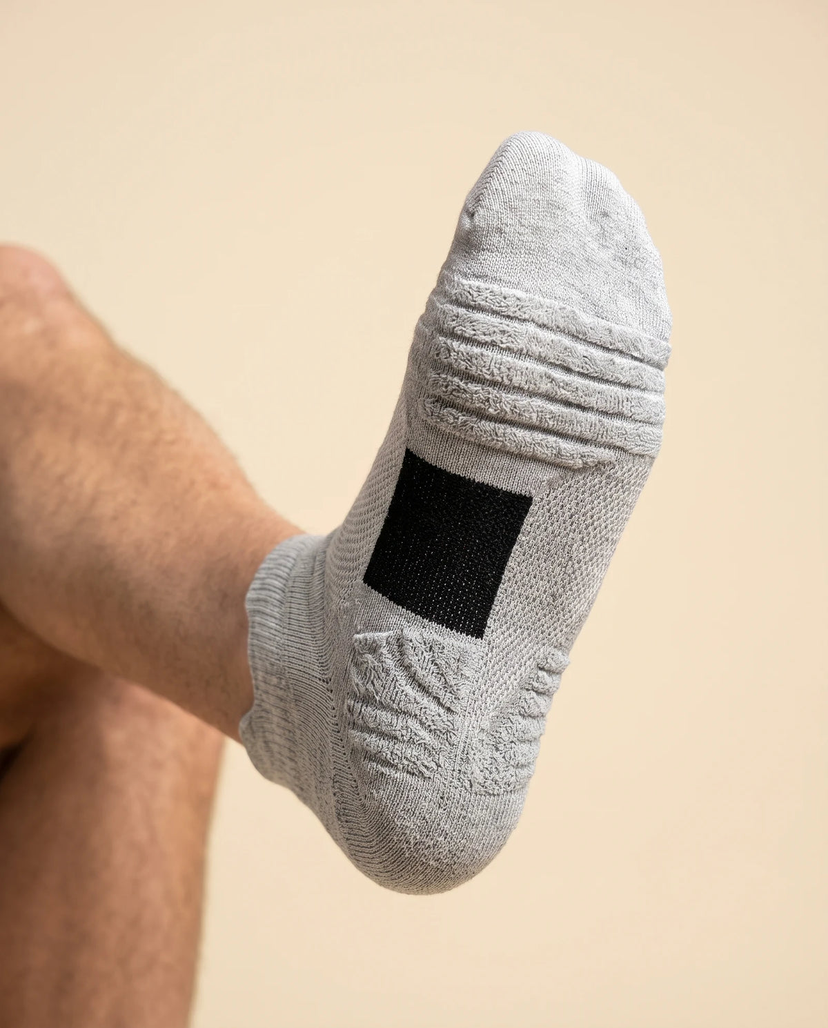 Underside of the sock showing the cushioned terry sole